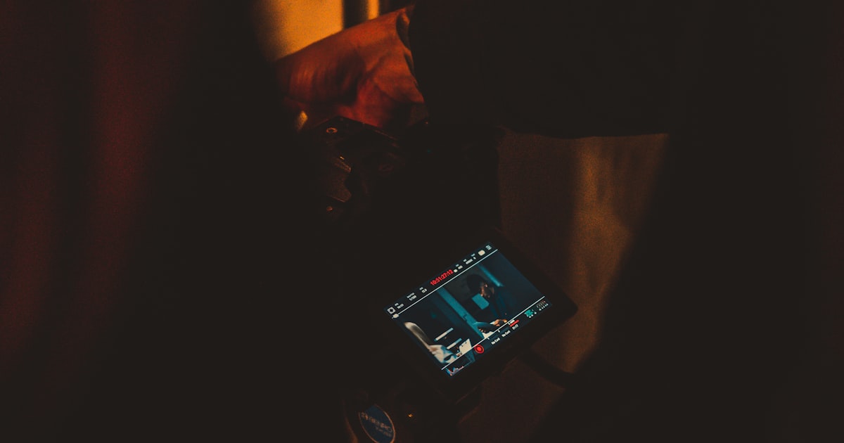 a person holding a cell phone in their hand