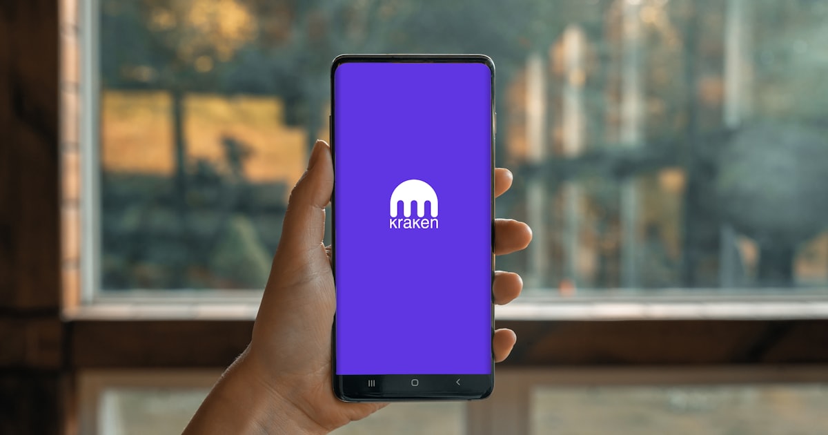 a hand holding a cell phone