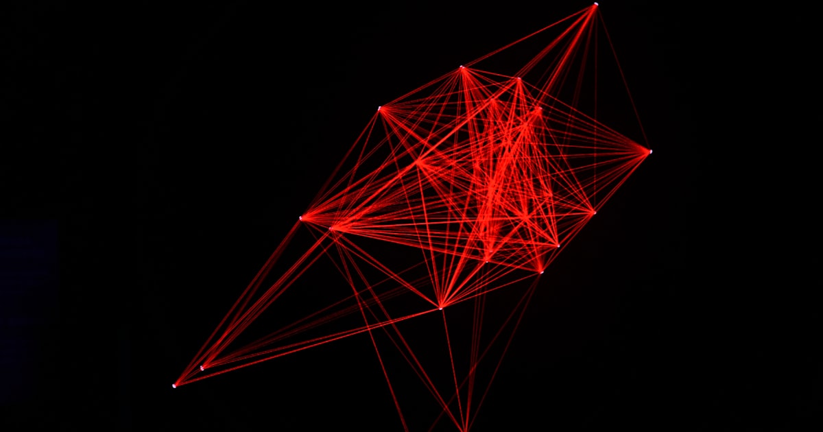 Abstract red geometric network on black background
