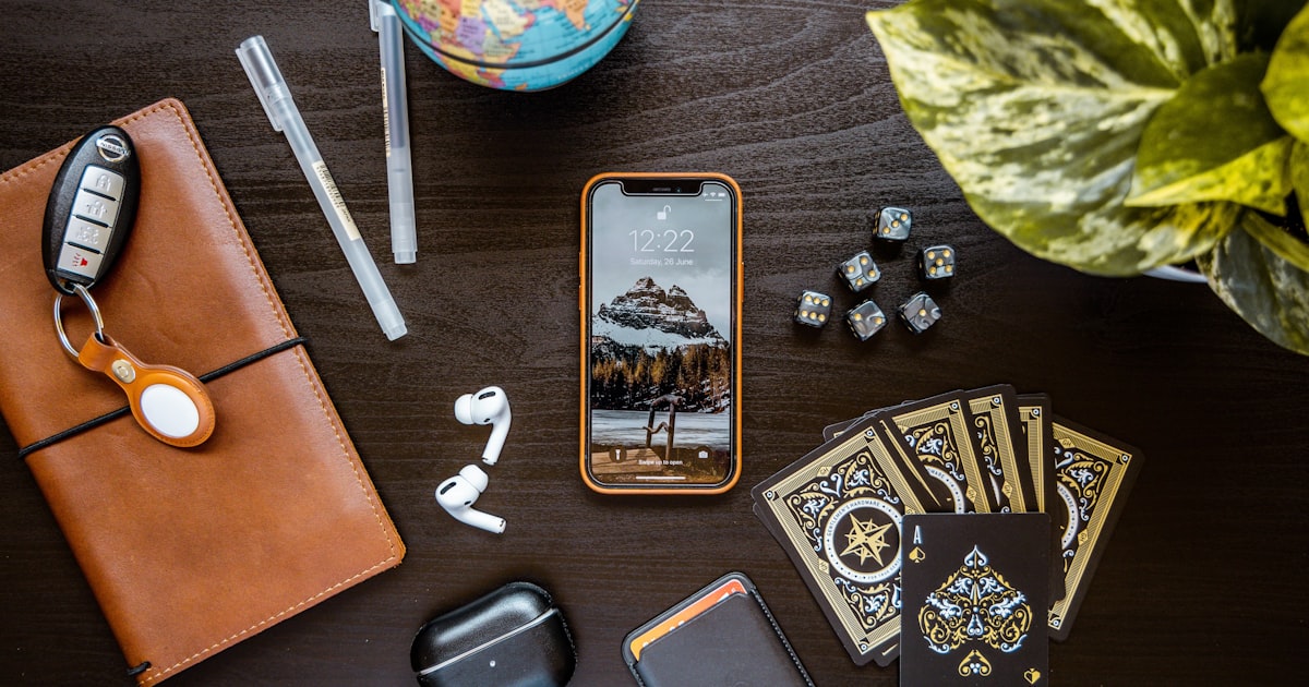 silver iphone 6 beside white pen and white pen
