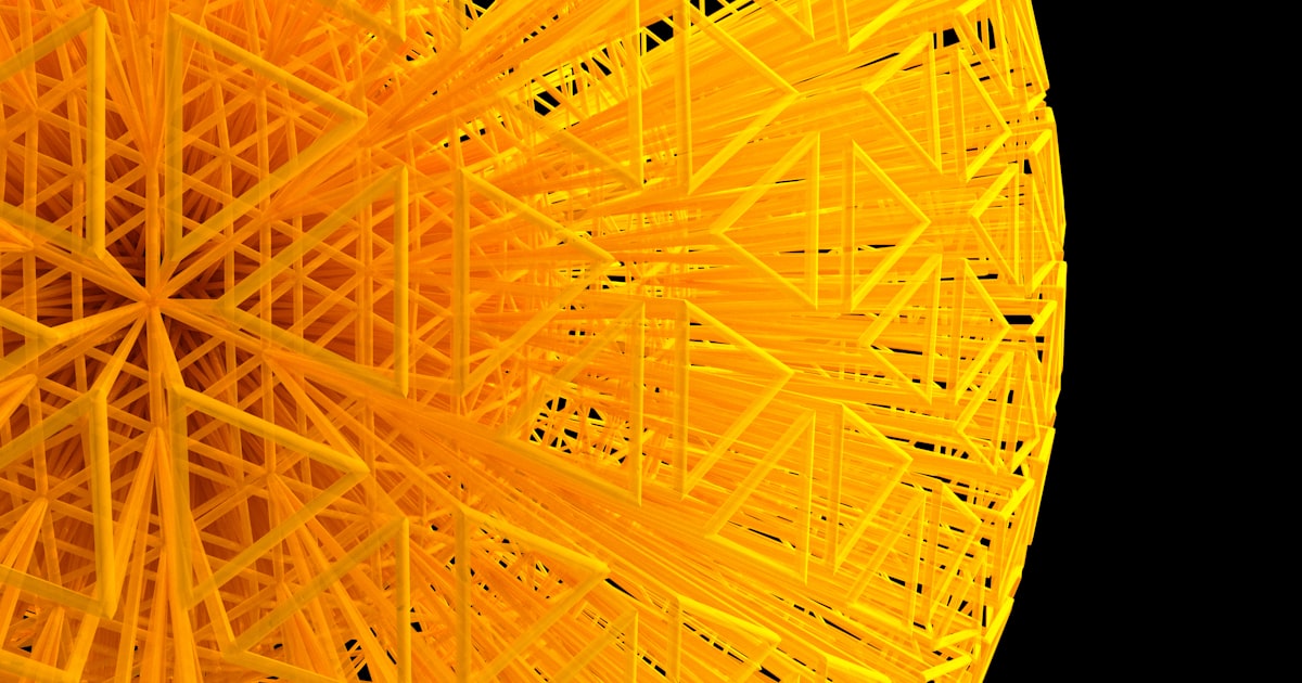 A close up of a yellow object with a black background