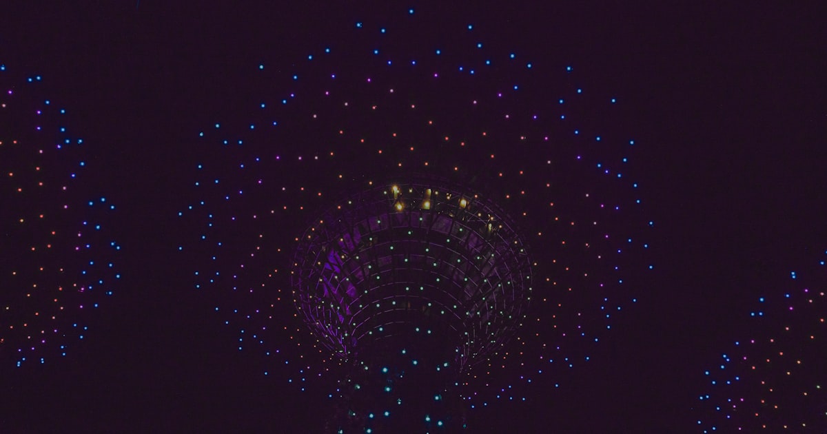 Drones create colorful light displays at night.
