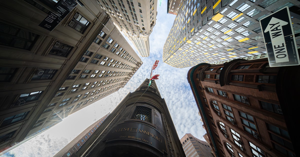 Looking up at tall buildings in a city
