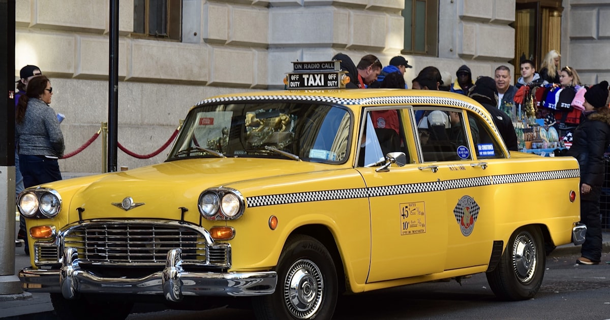 a yellow car on the street
