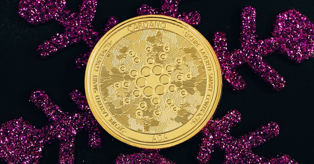 a close up of a gold coin surrounded by purple glitter