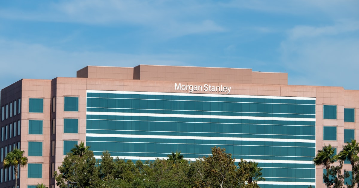 a large building with trees in front of it