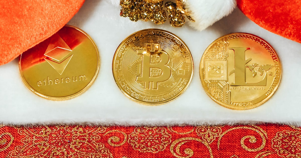 three gold bitcoins sitting next to each other