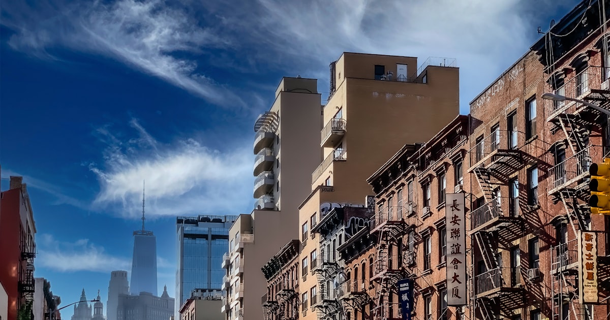white and brown concrete buildings under blue sky during daytime