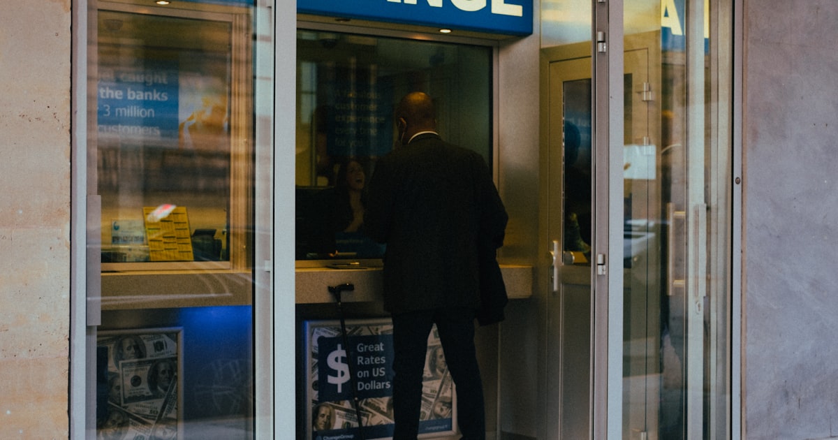 a man walking out of a store