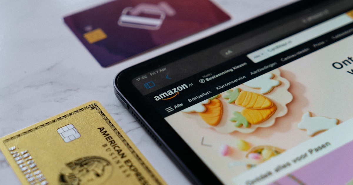 a smart phone sitting next to a credit card