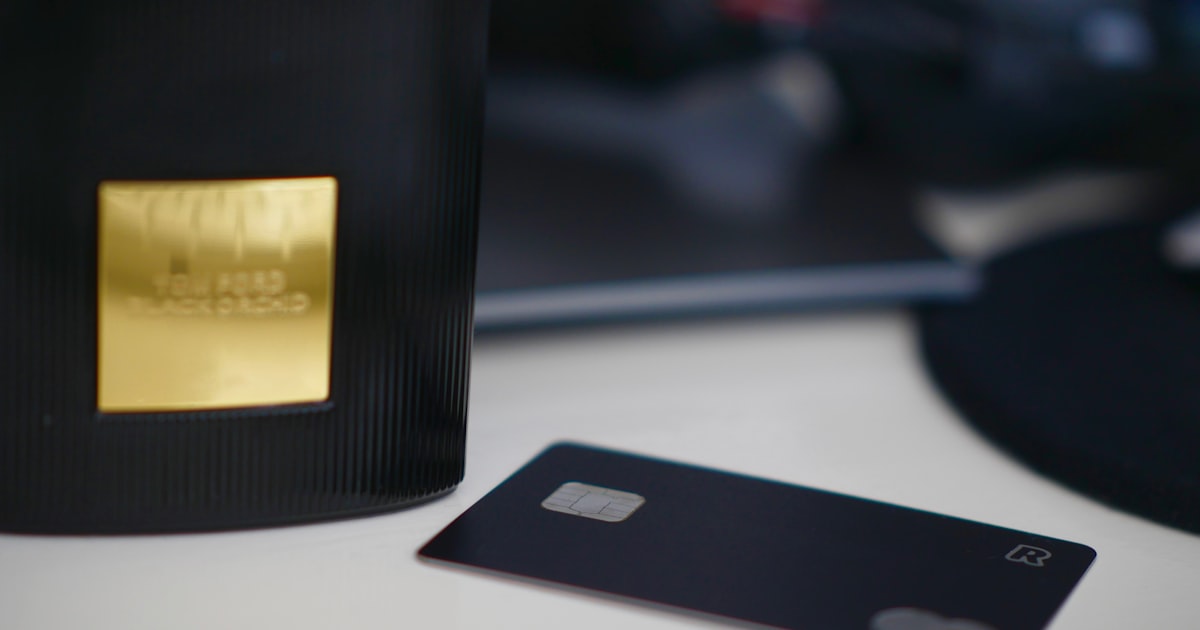 selective focus photography of black card on white table