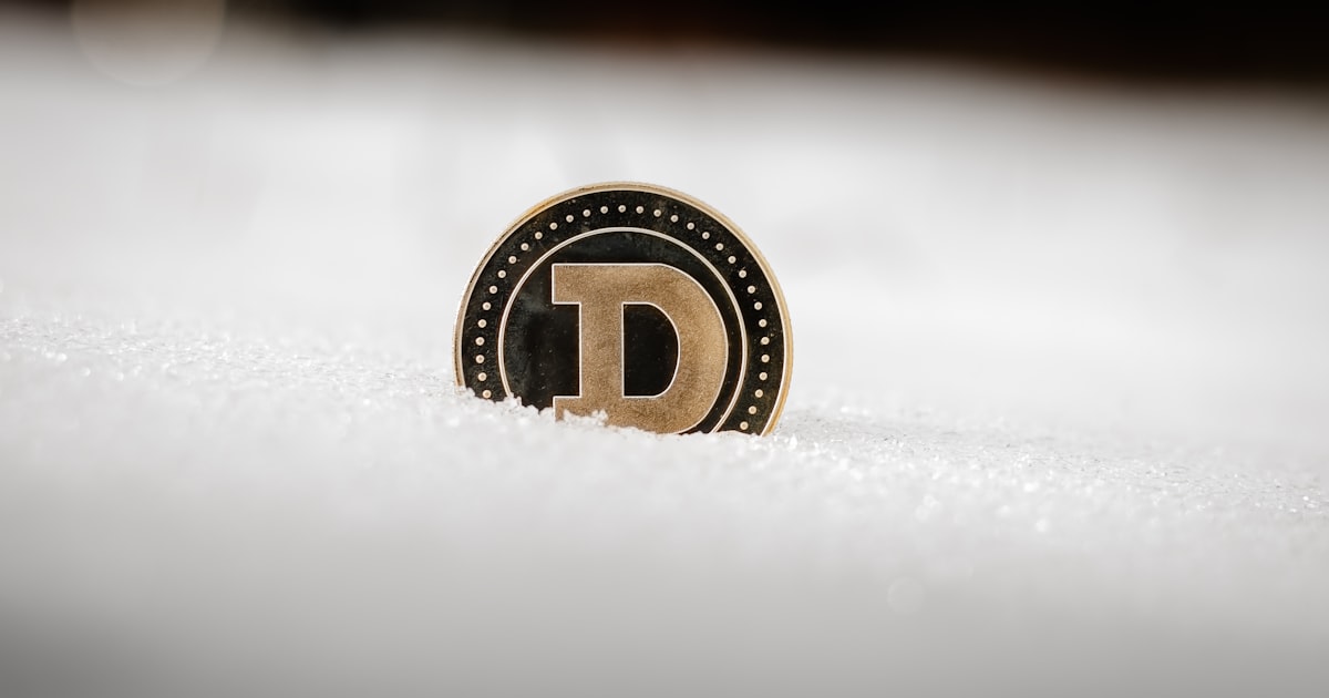 a close up of a logo on a snow covered surface