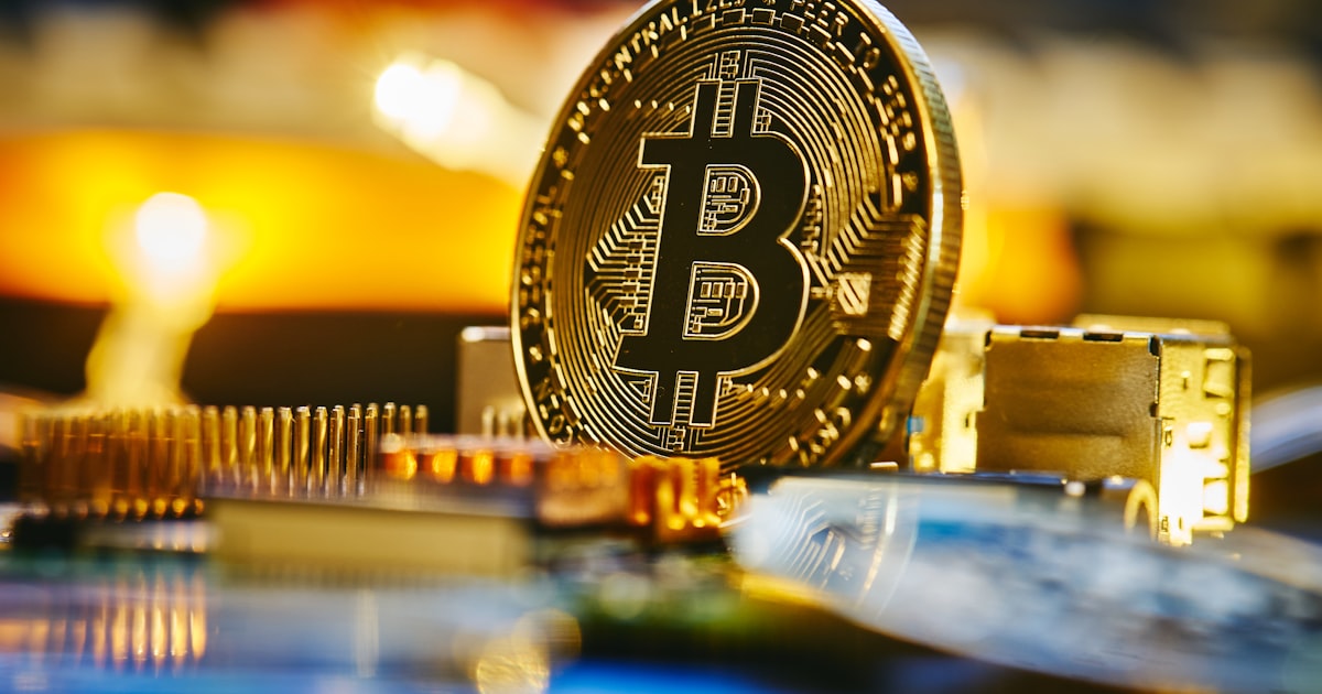 a bitcoin sitting on top of a computer chip