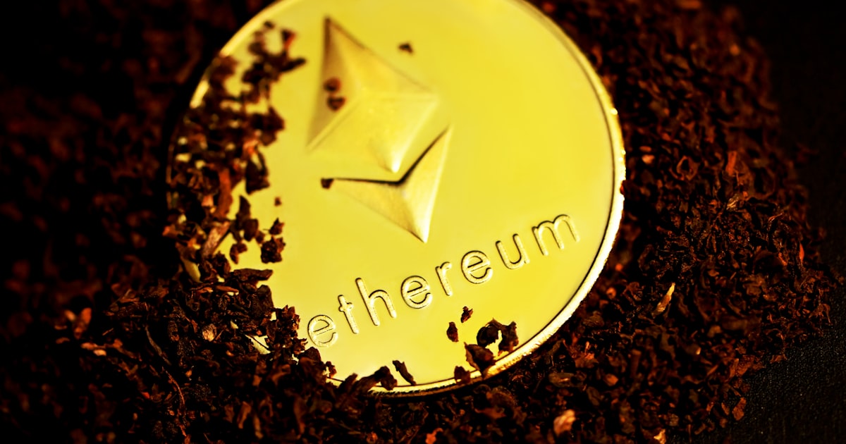 gold round coin on brown and black surface