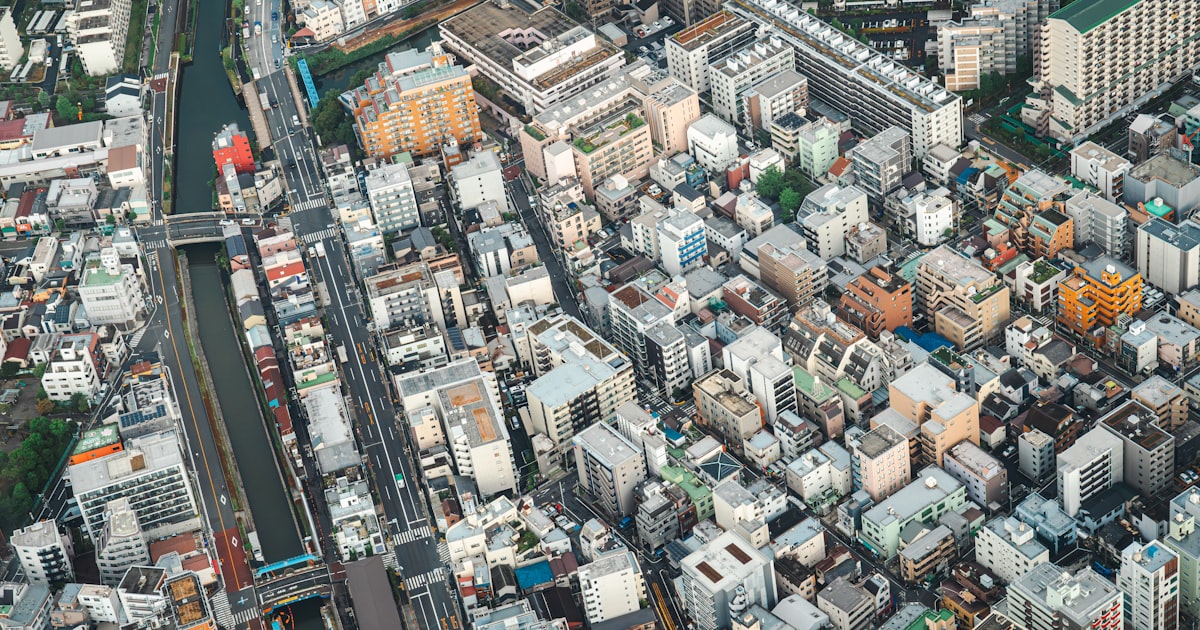 an aerial view of a city with lots of tall buildings