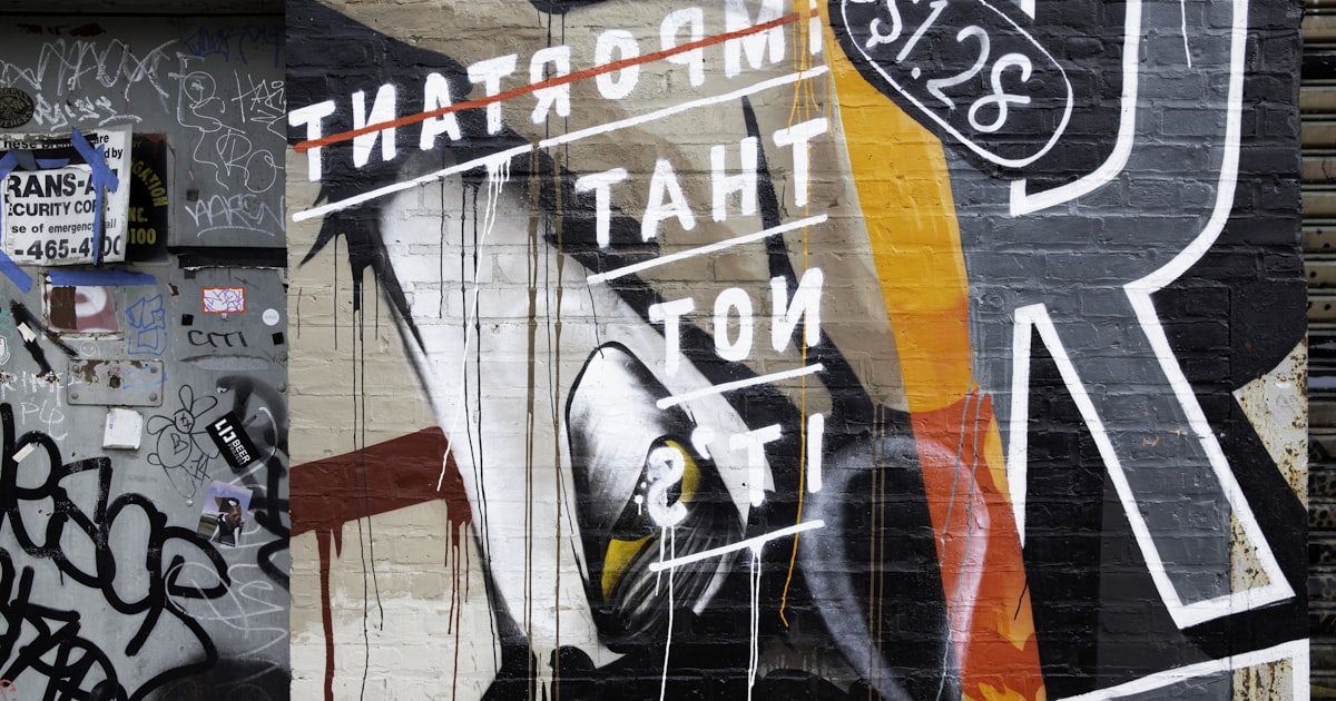 Graffiti art on a brick wall with price tag