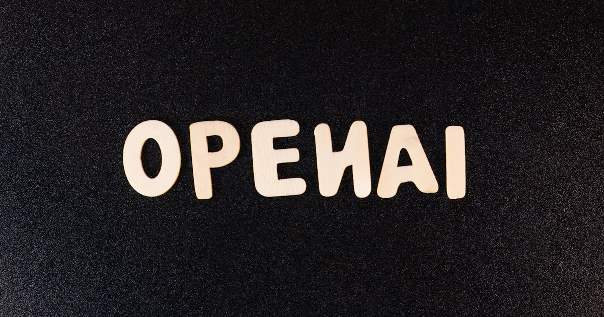 a close up of a black surface with white letters
