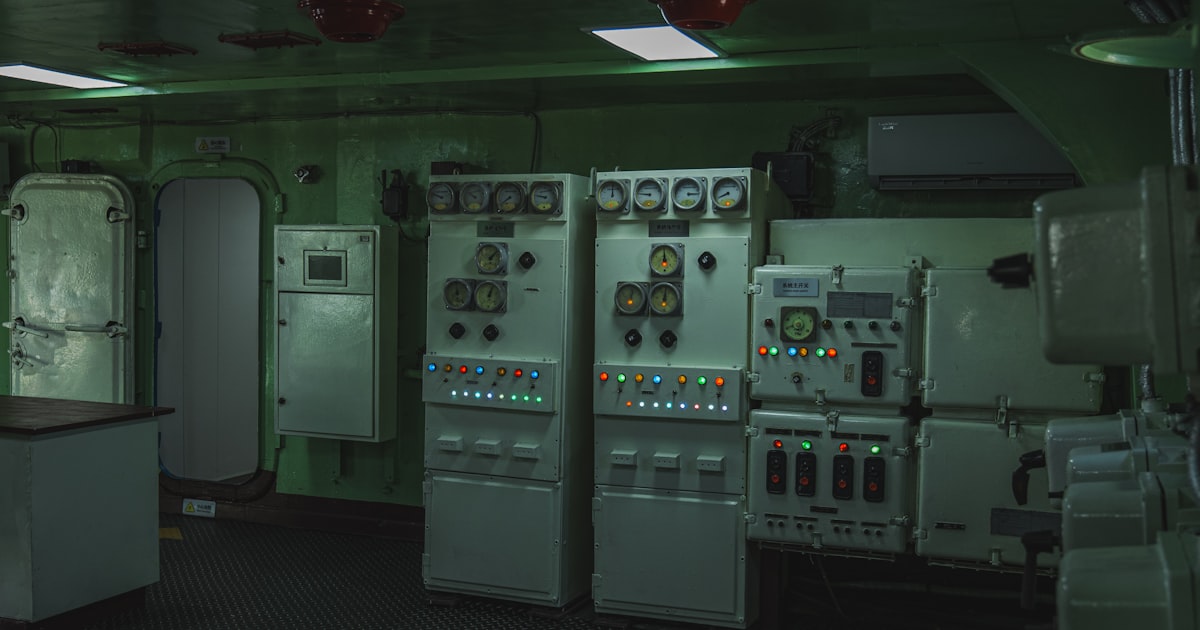 Control room with electrical panels and gauges
