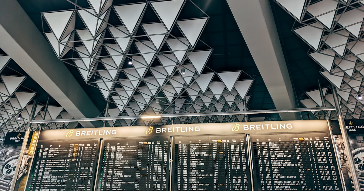 a large menu board in a train station