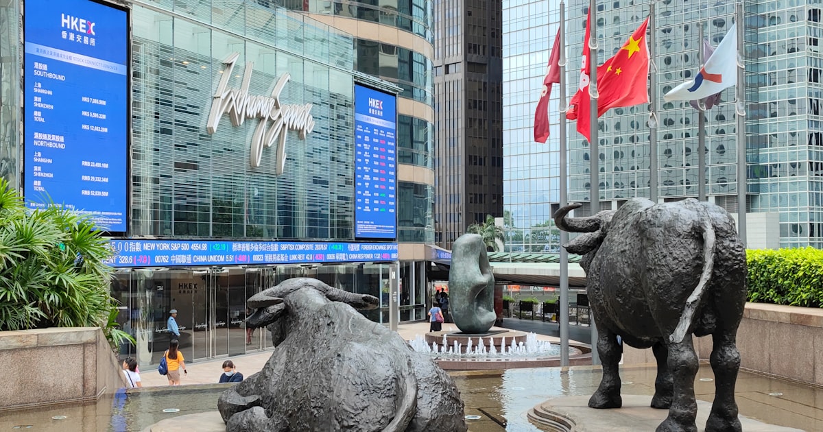 a statue of two bulls in front of a building
