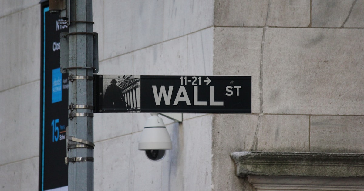 A street sign on the corner of wall street