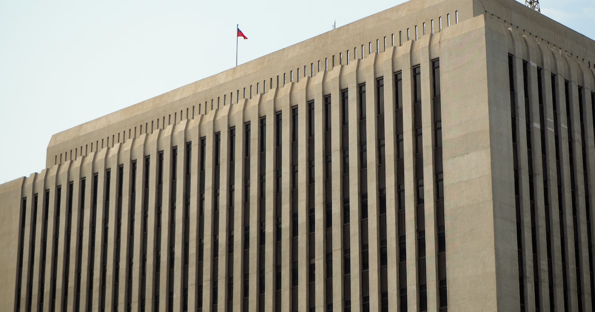 A modern building shows vertical architectural lines.