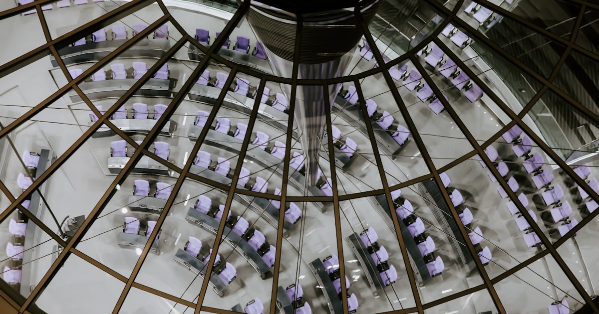a room with a glass ceiling filled with purple cubes