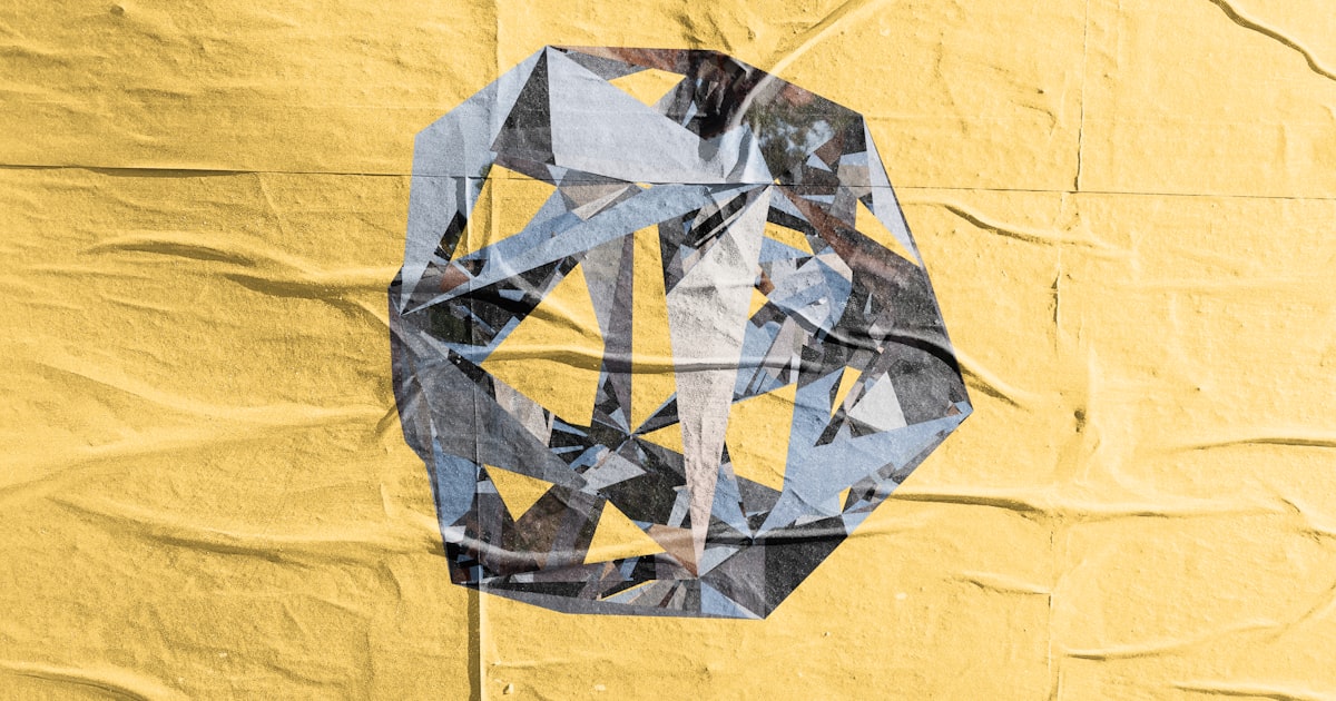 Abstract geometric shape on crumpled yellow paper