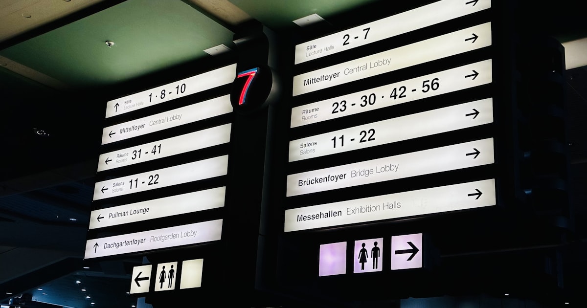 a large sign in the middle of an airport