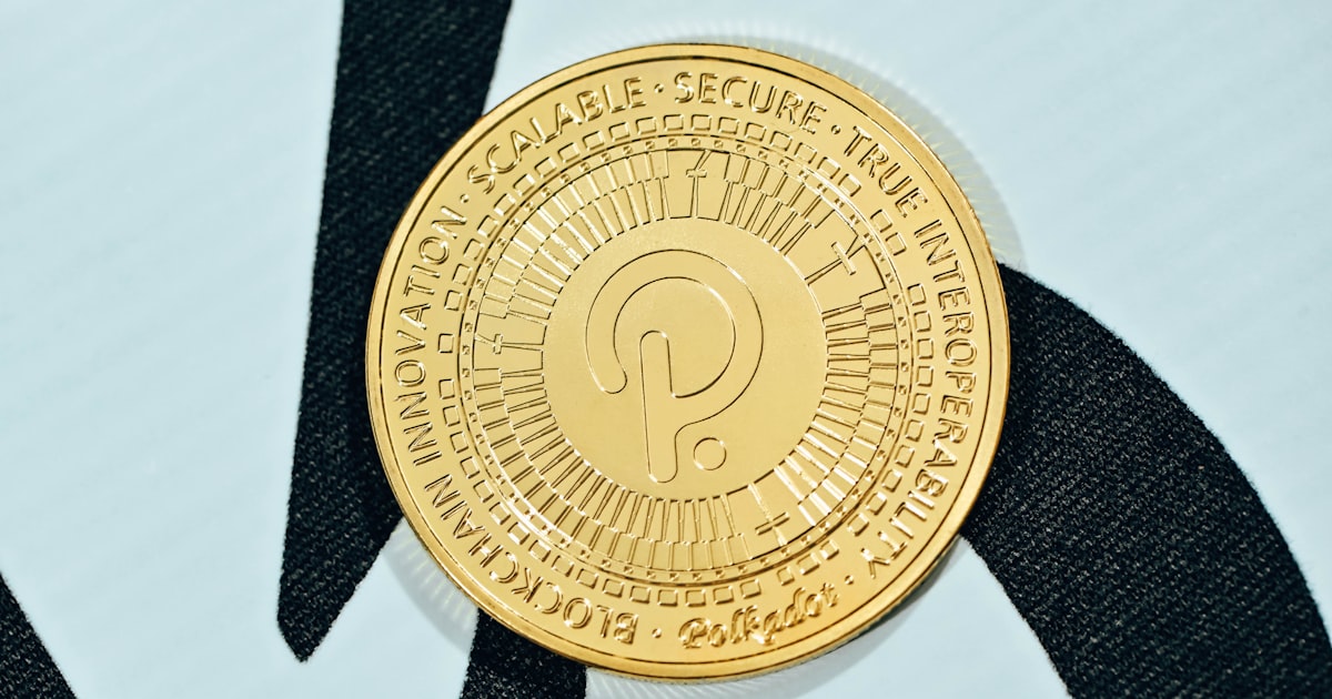 a close up of a gold coin on a black and white background