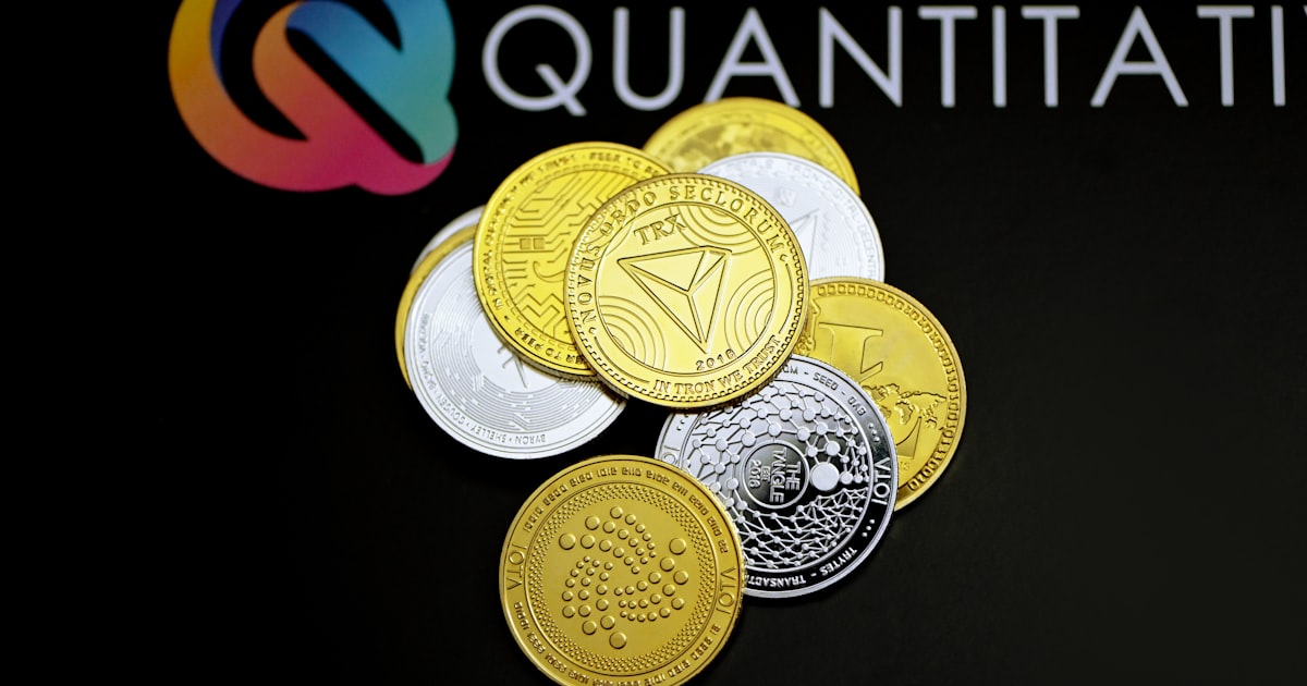 a pile of coins sitting on top of a black table