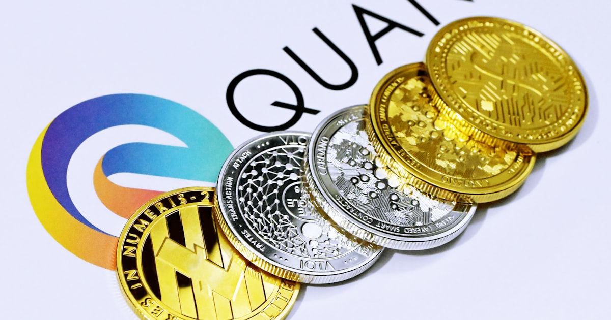 a pile of coins sitting on top of a white table