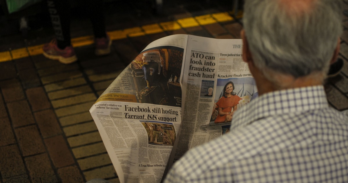 man reading newspaper