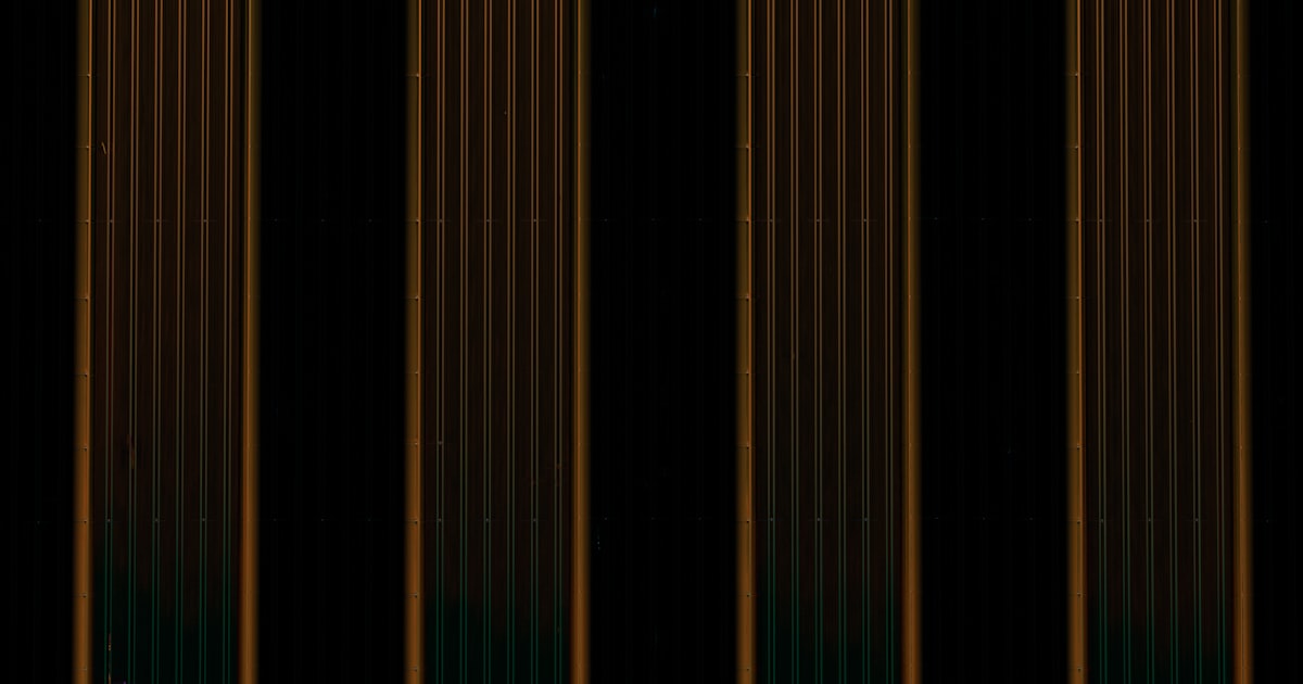 Vertical lines with varying brown and green tones.