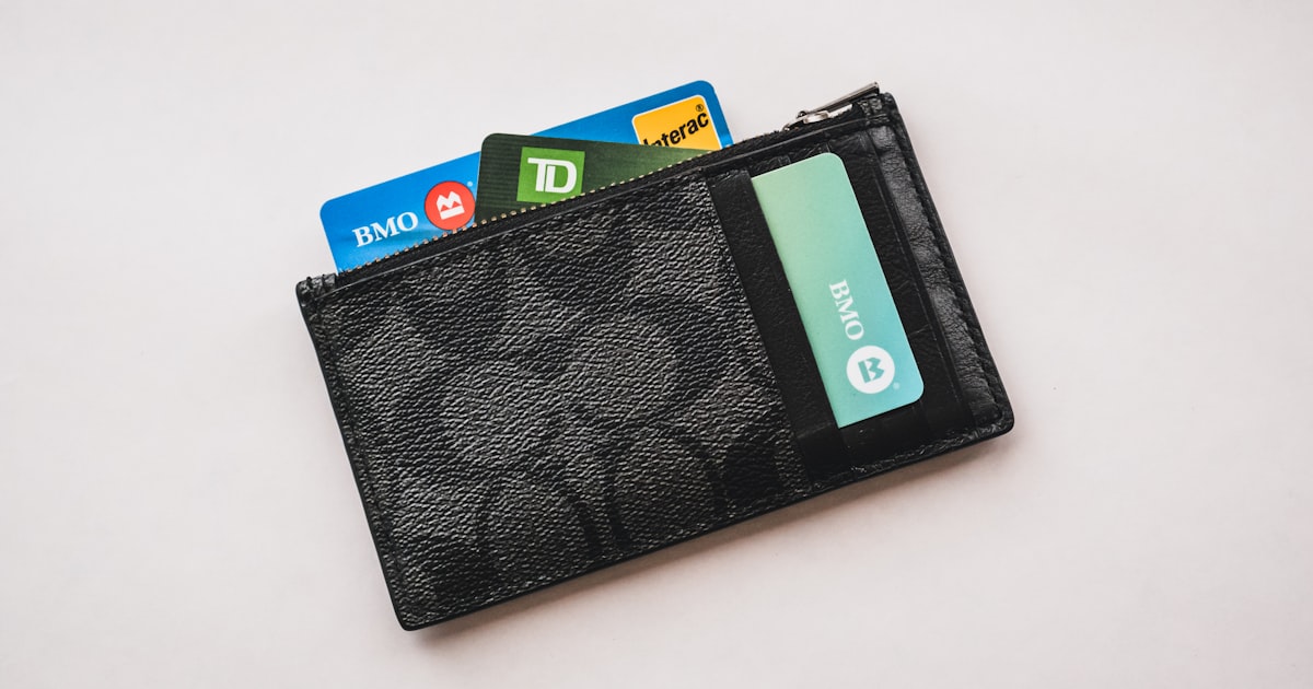 a wallet with credit cards sticking out of it