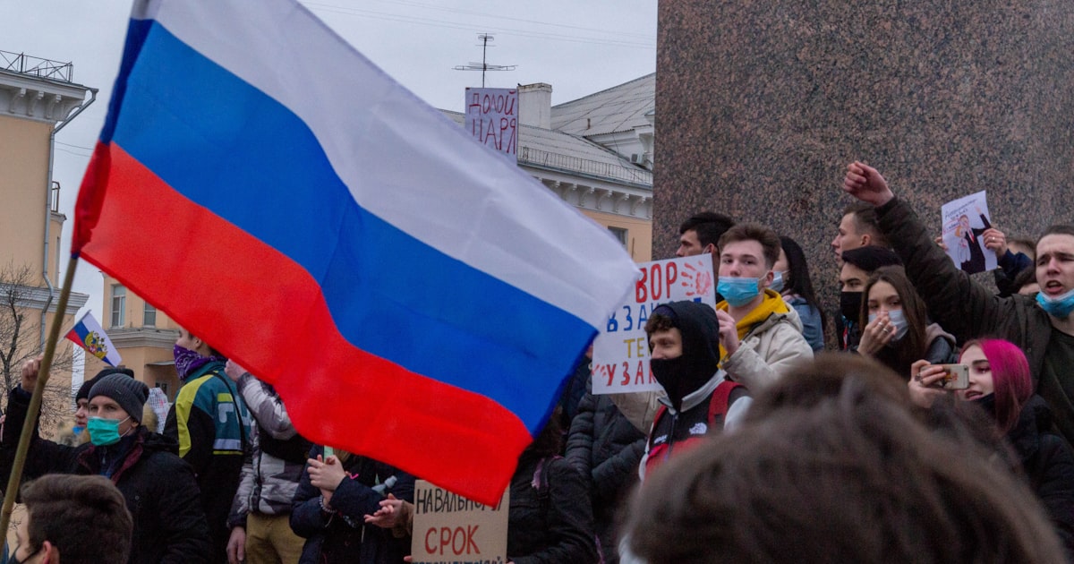 a group of people holding flags