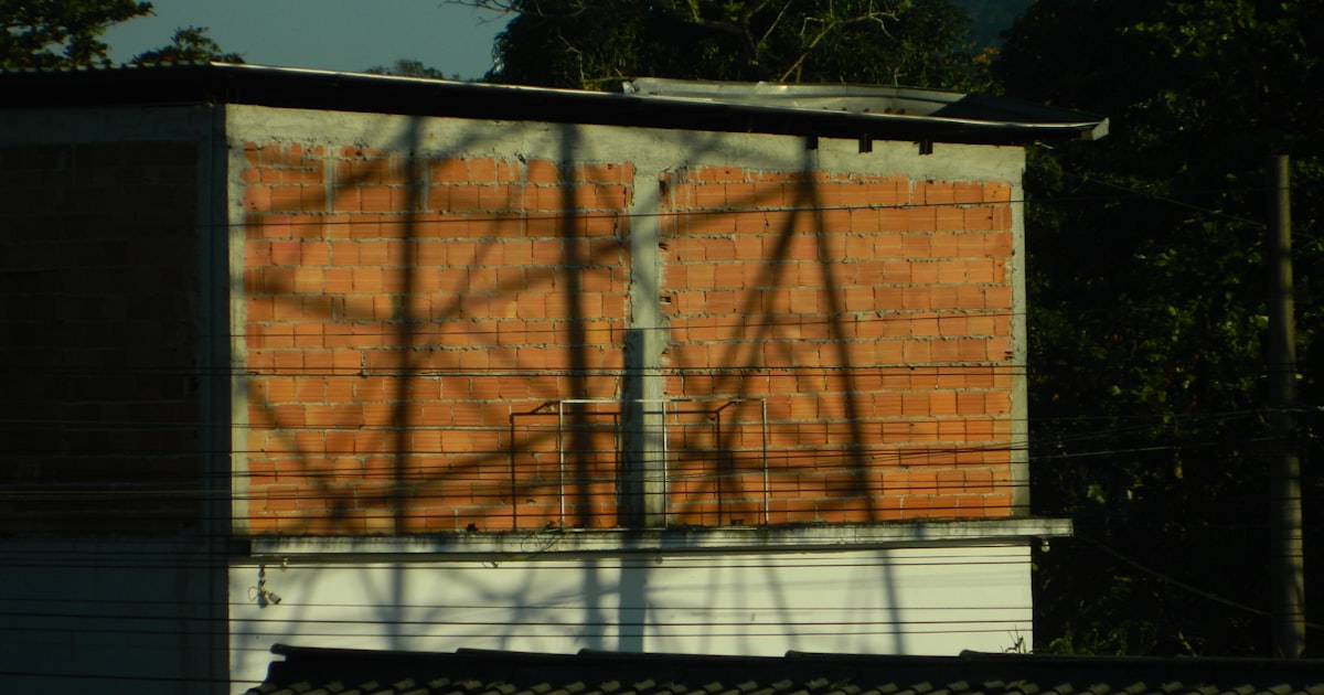 A building with a water tower in the background