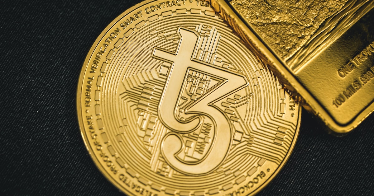 a gold coin with a bitcoin on top of it