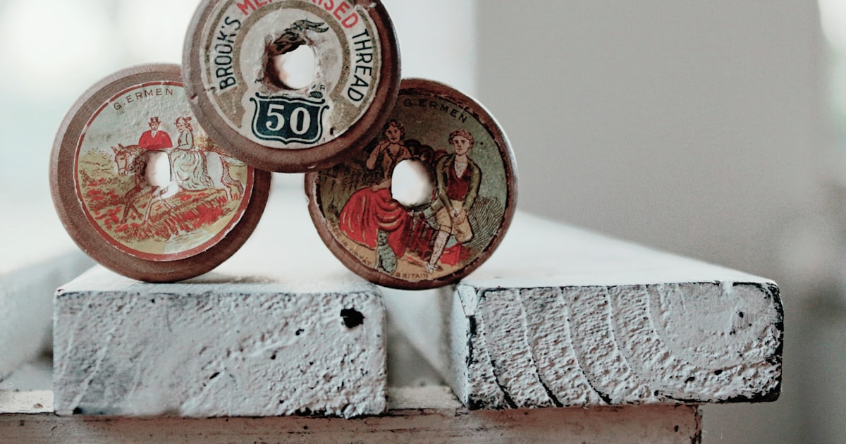 photo of three assorted-color-and-design commemorative coins