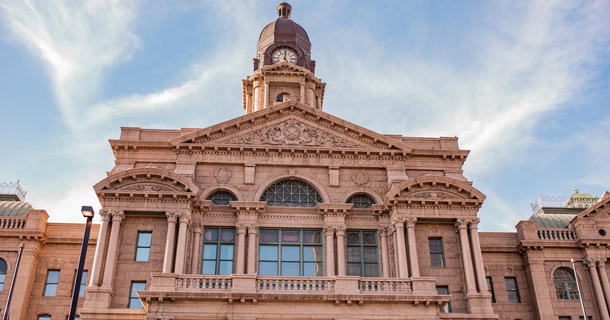 a large building with a clock on the top of it