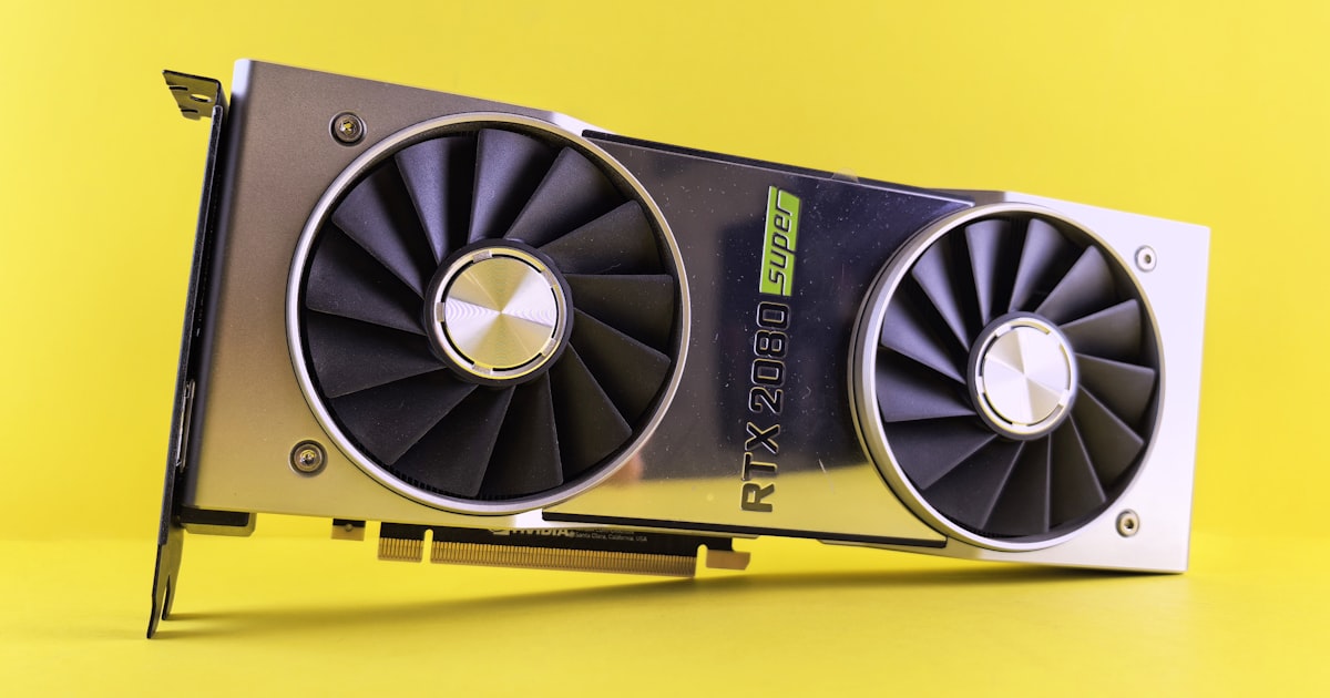 A close up of a video card on a yellow background