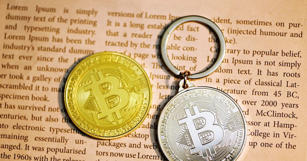 gold round coin on brown paper