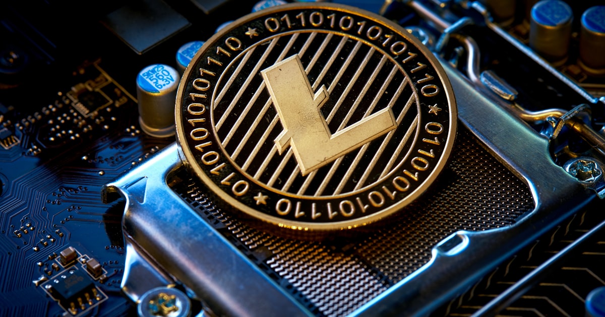 a close up of a computer chip with the letter l on it