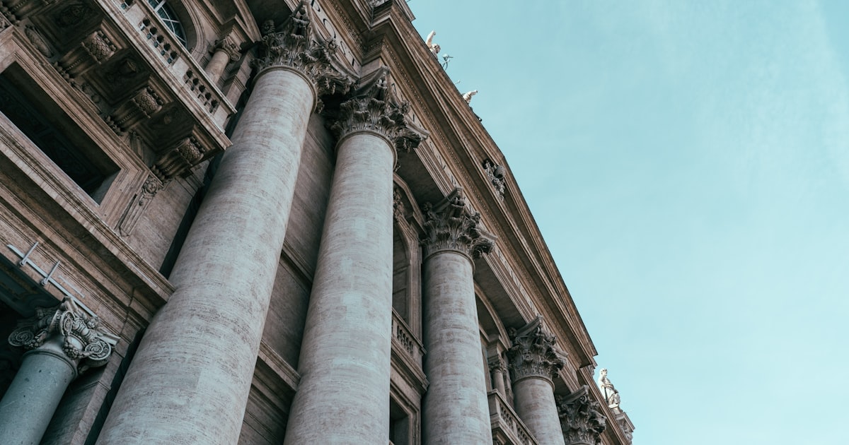low angle photography of gray concrete building