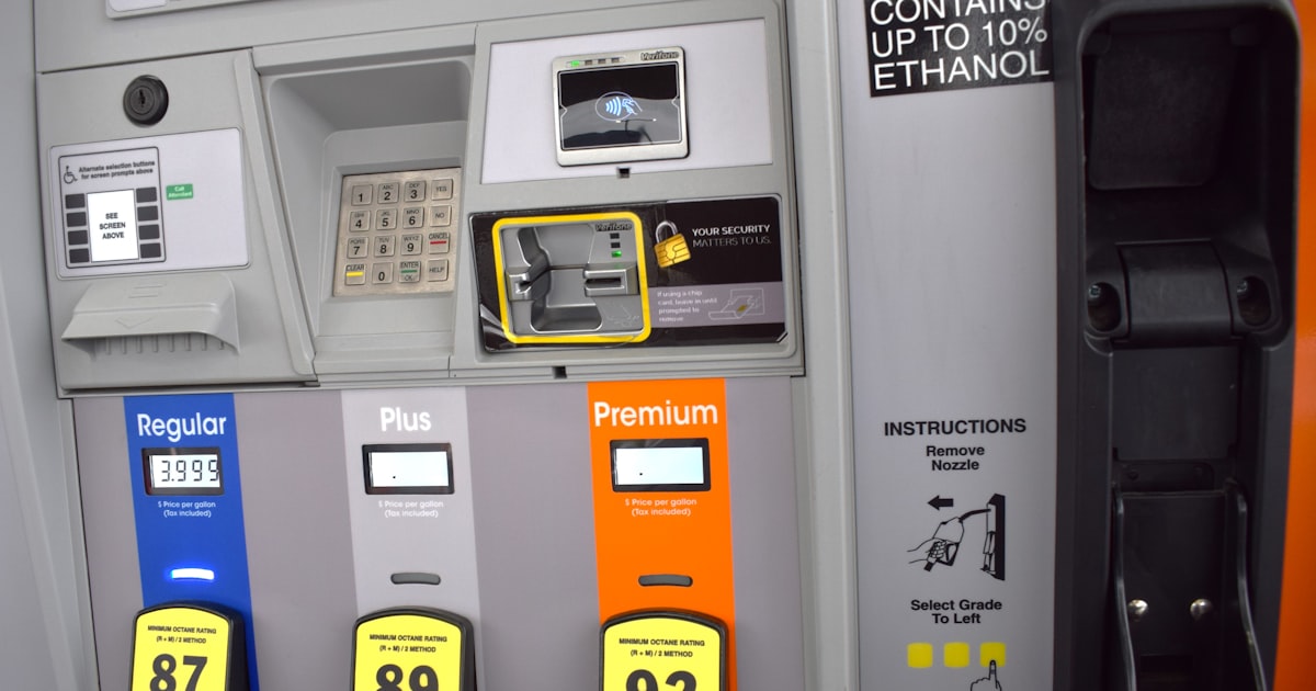 a close up of a gas pump with gas prices
