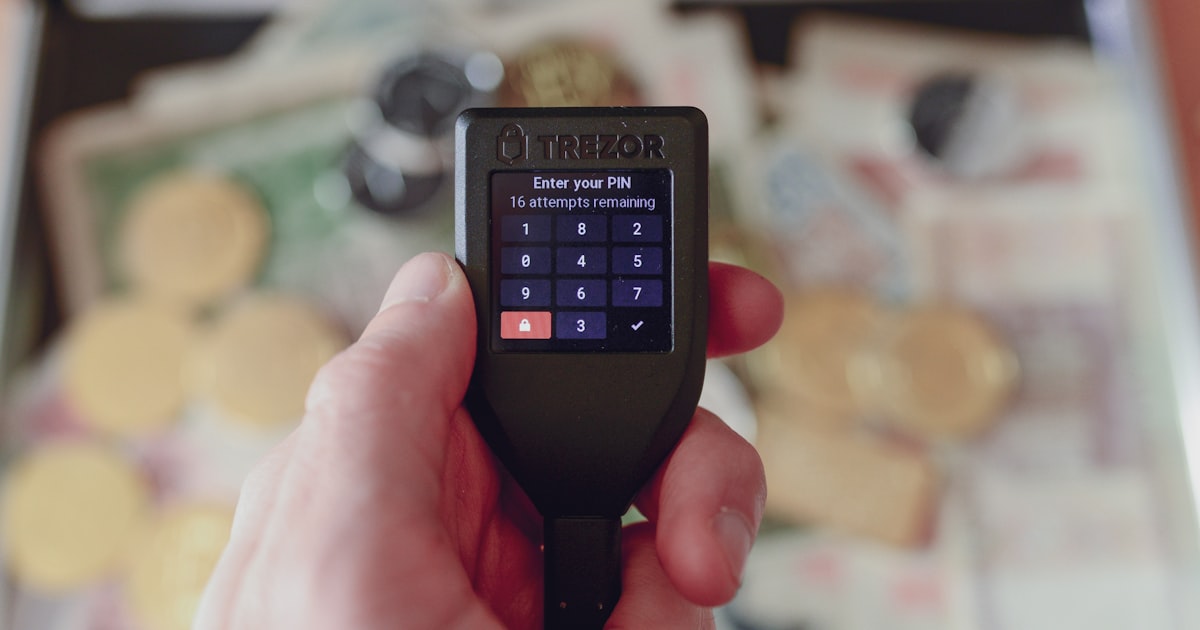 a person holding a cell phone in their hand