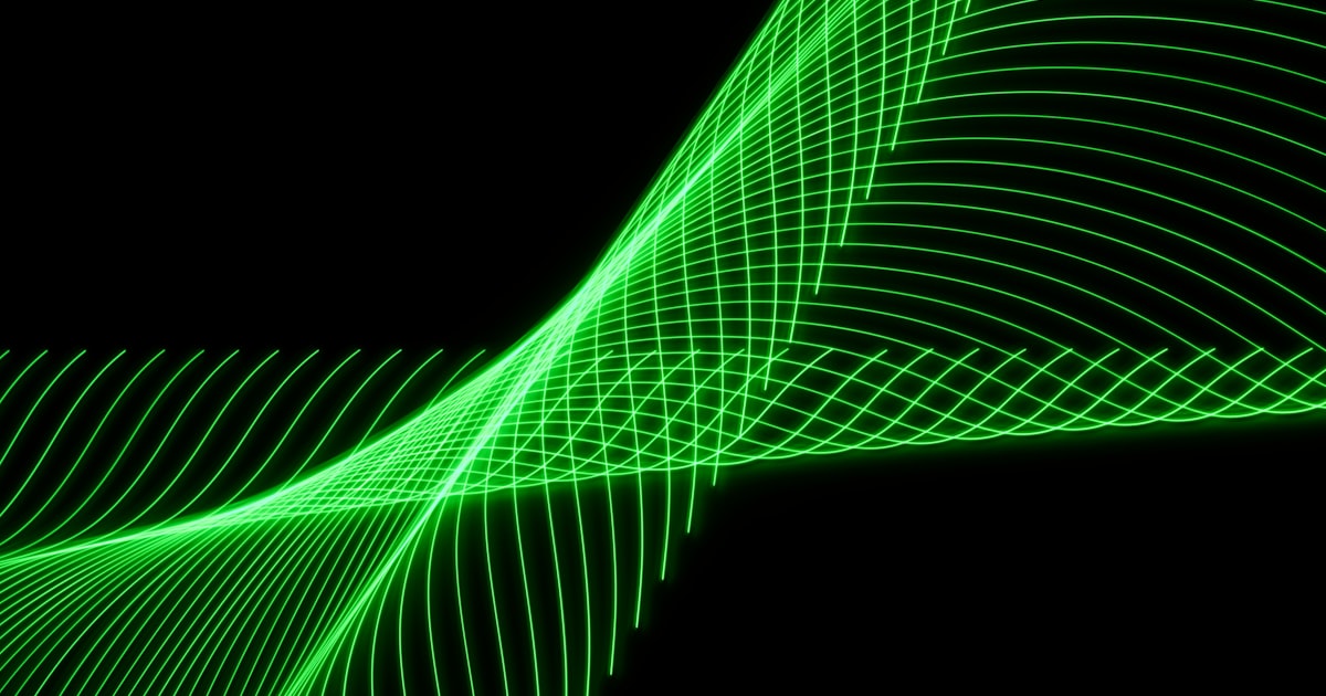 a green wave of light on a black background