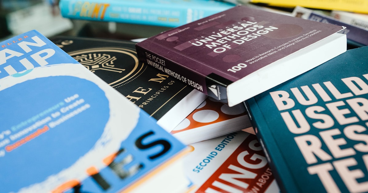 red and blue book on white shelf