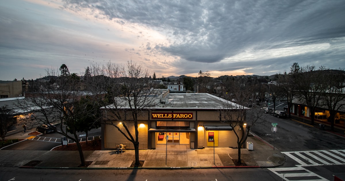 a building with a cloudy sky in the background