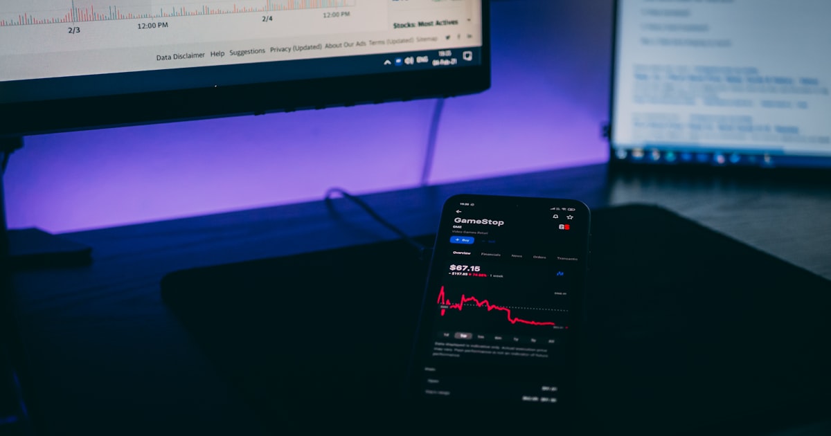 black android smartphone on black laptop computer